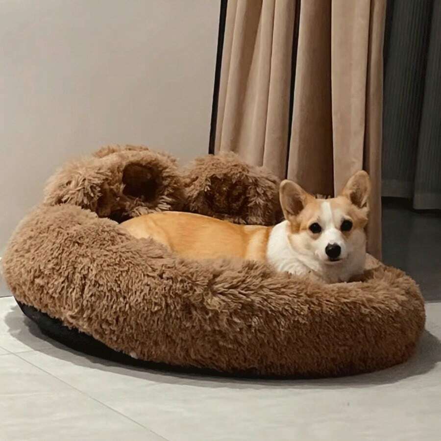 Brown plush donut pet bed with a curved headrest for cats and dogs made of soft polyester material.