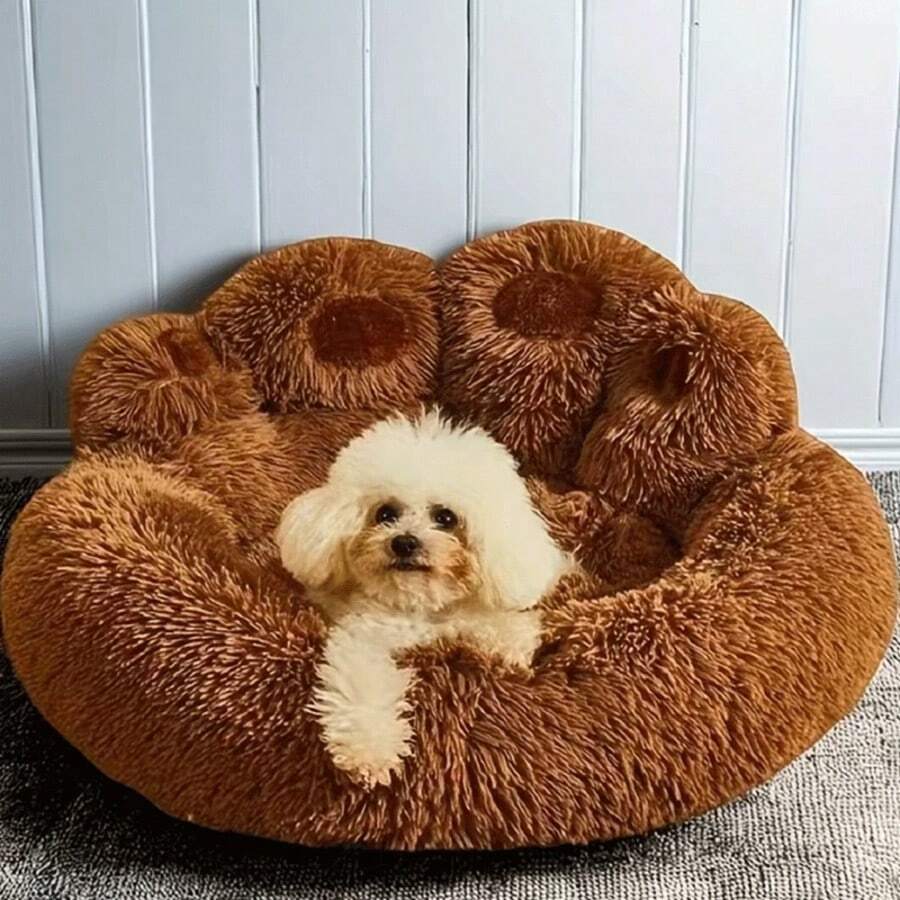 Brown plush donut pet bed with a curved headrest for cats and dogs made of soft polyester material.