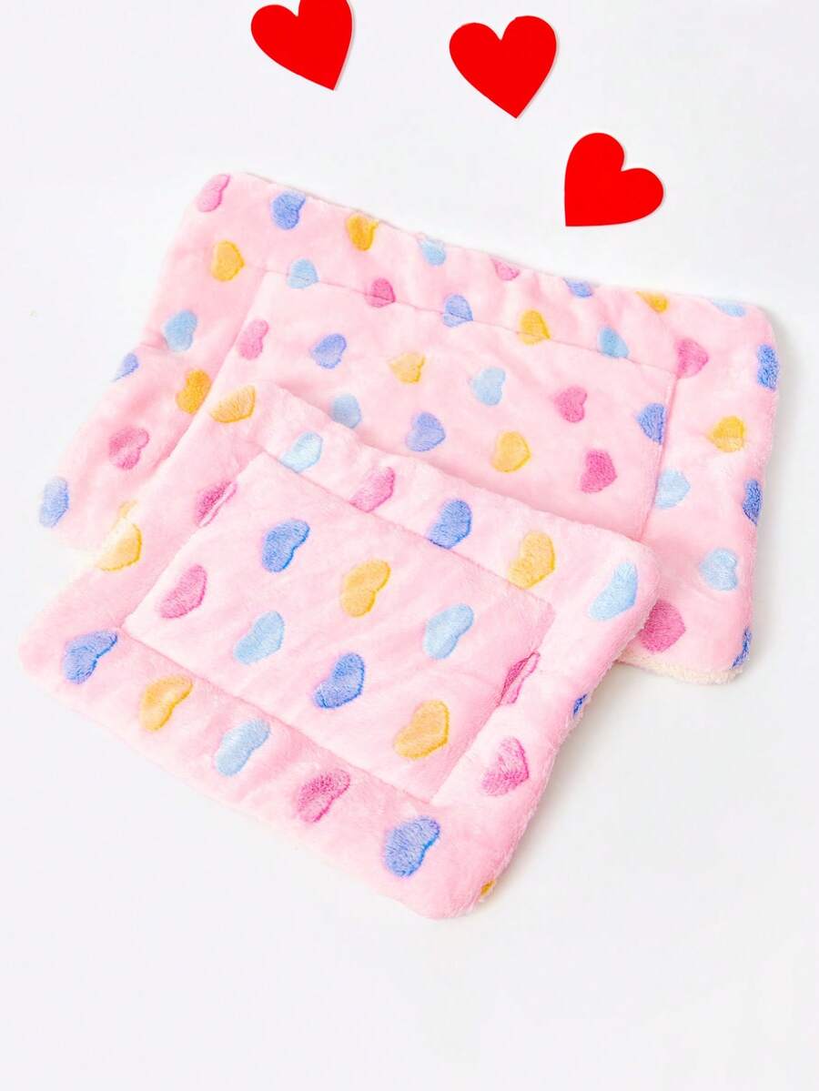 Pink heart-shaped warm pet bed featuring a geometric pattern for cats and small dogs.