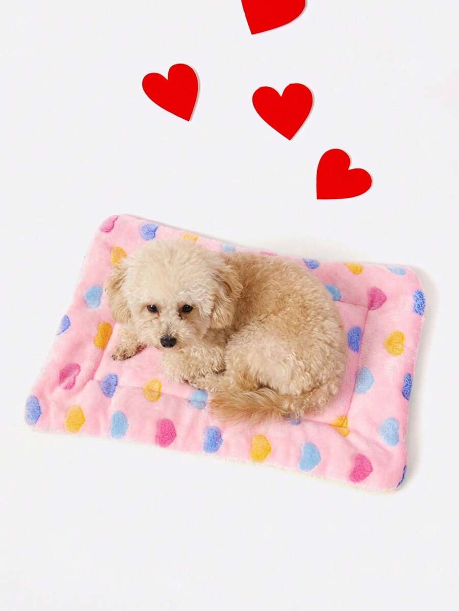 Pink heart-shaped warm pet bed featuring a geometric pattern for cats and small dogs.