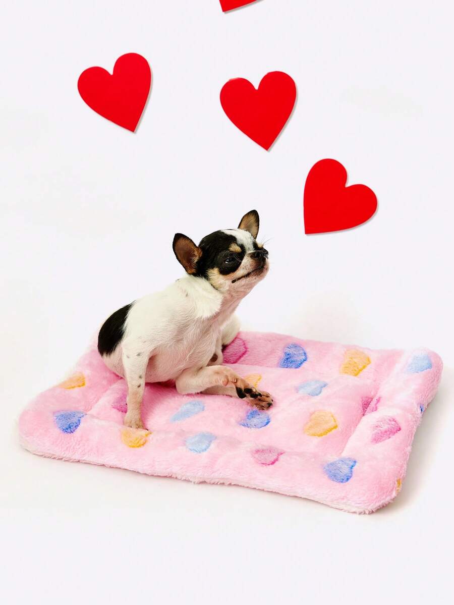 Pink heart-shaped warm pet bed featuring a geometric pattern for cats and small dogs.