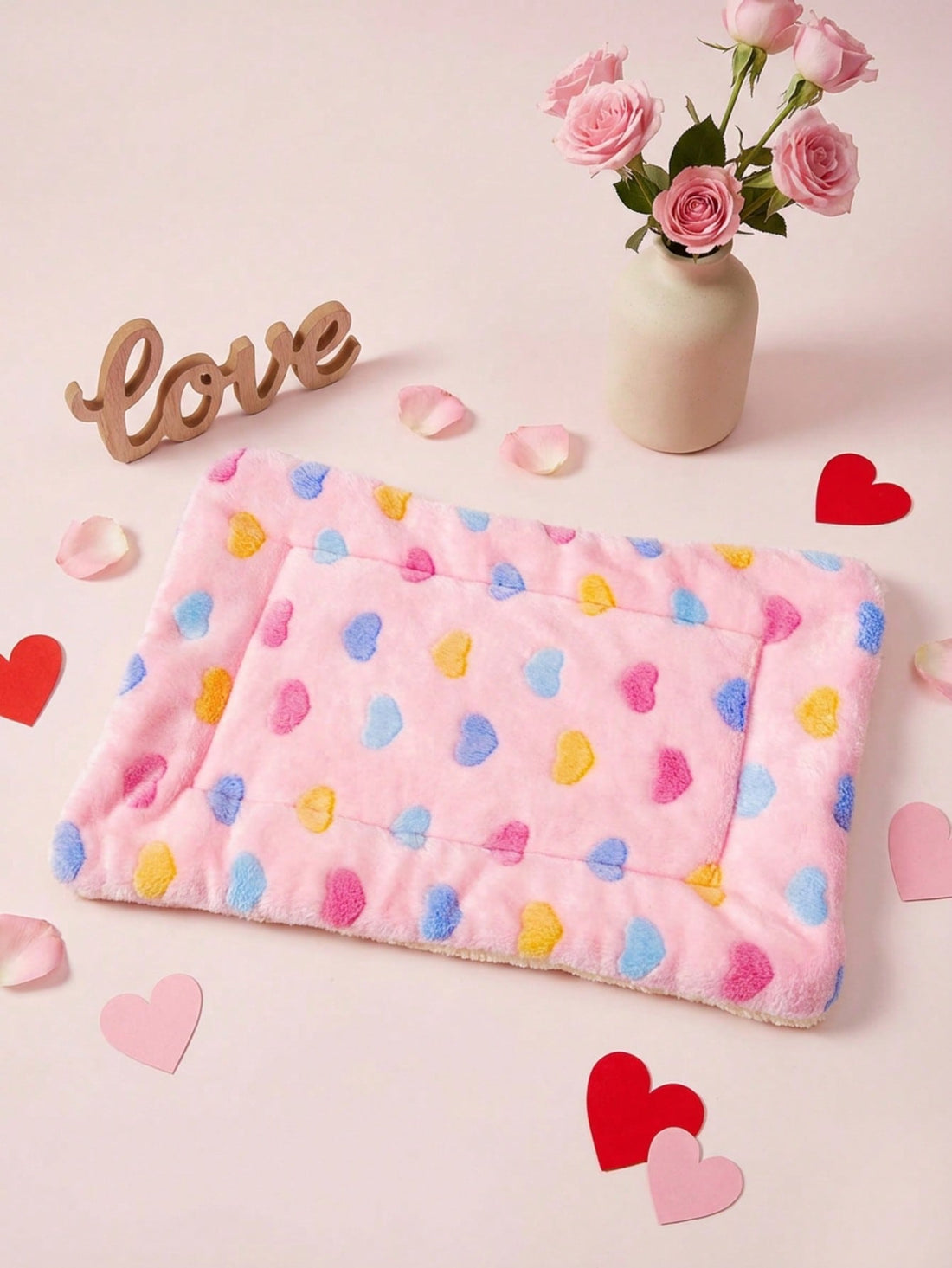 Pink heart-shaped warm pet bed featuring a geometric pattern for cats and small dogs.
