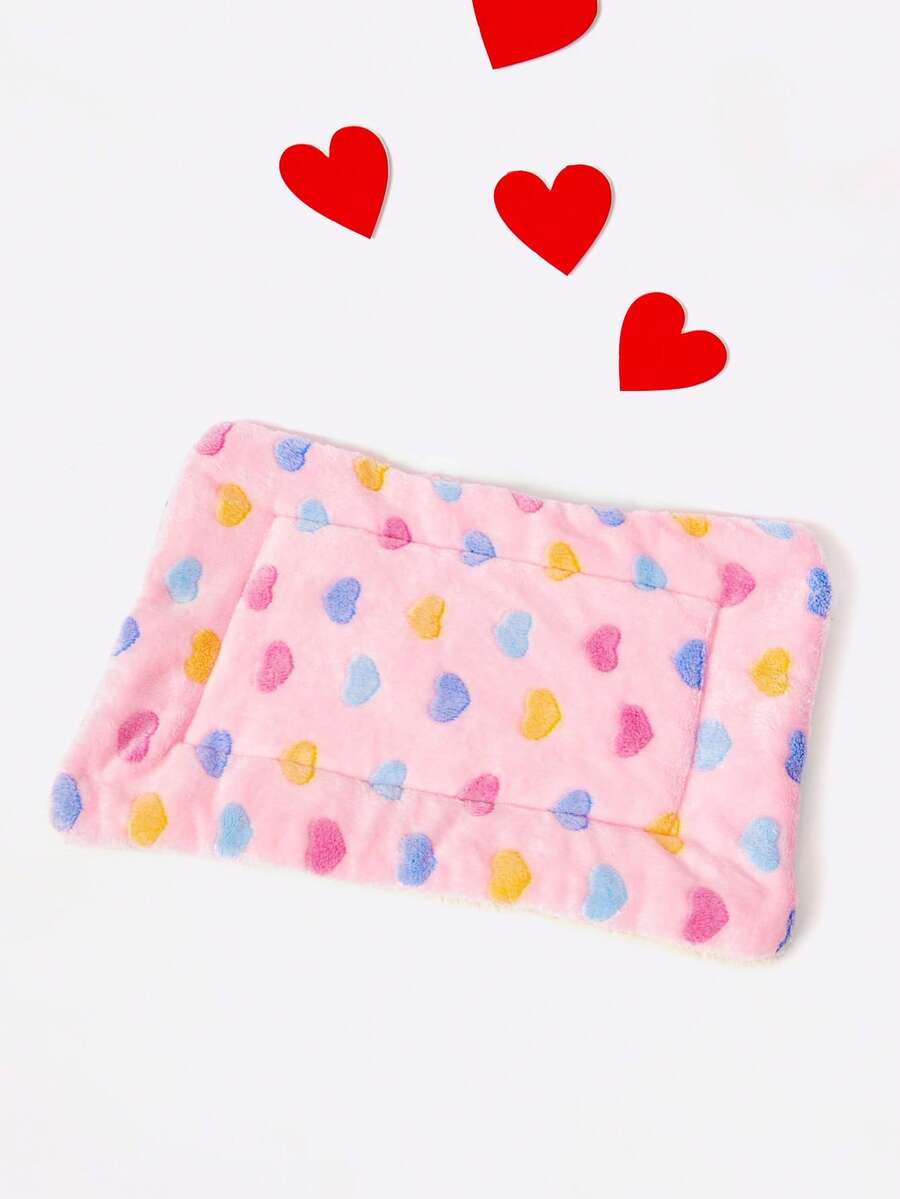 Pink heart-shaped warm pet bed featuring a geometric pattern for cats and small dogs.