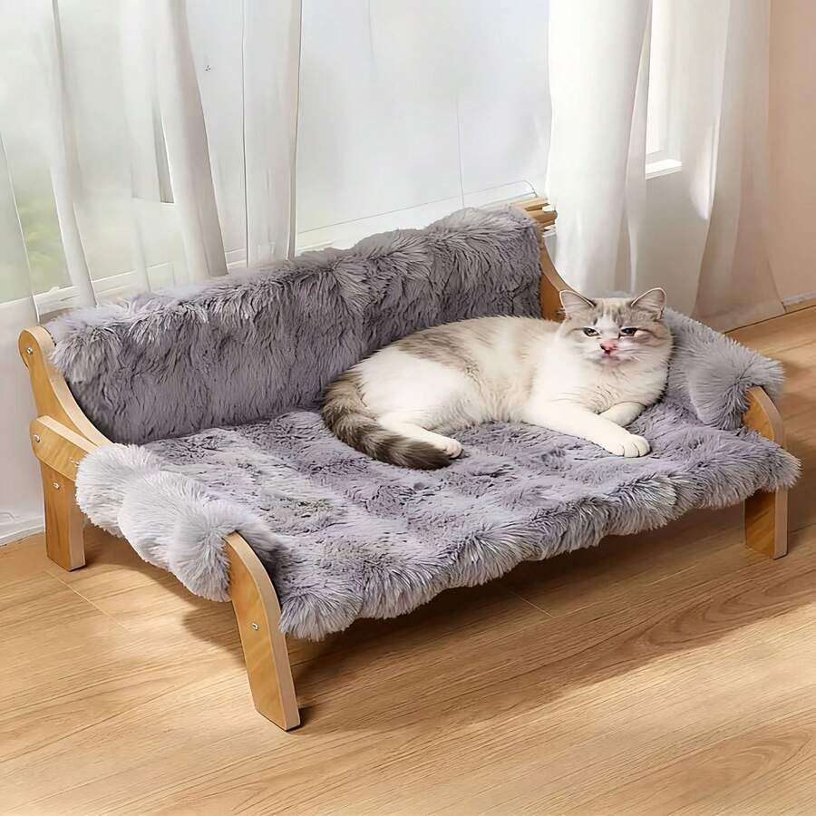 Elevated wooden pet sofa bed featuring a brown memory foam cushion with a removable washable cover, designed for cats and dogs.