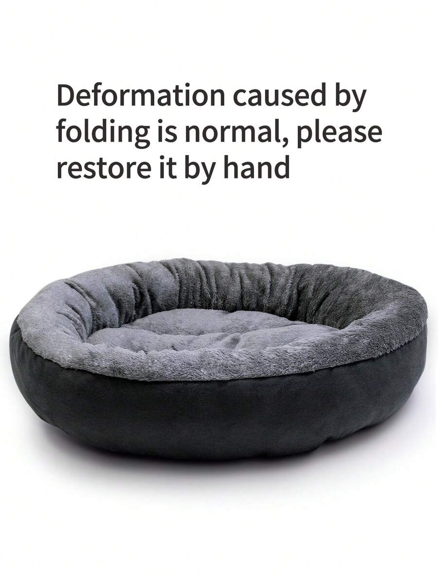 Dark grey plush donut calming pet bed for cats and dogs featuring a soft round design and non-slip bottom.