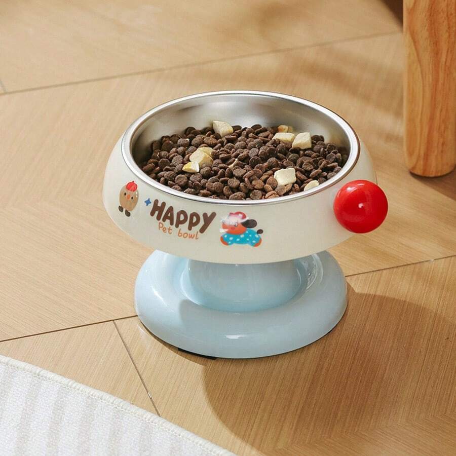 Elevated pet food bowl with cute cartoon style design, stainless steel lining, PP stand, and anti-slip base for cats and dogs.