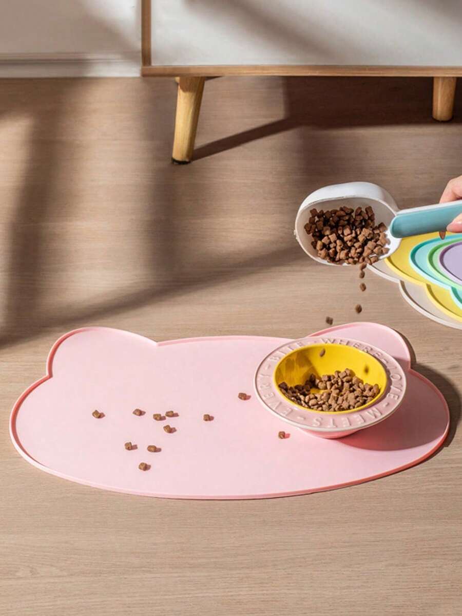 Multicolor silicone pet food mat with cartoon pattern, waterproof non-slip surface, and raised edges for dog and cat bowls.