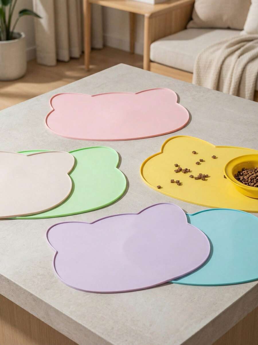 Multicolor silicone pet food mat with cartoon pattern, waterproof non-slip surface, and raised edges for dog and cat bowls.