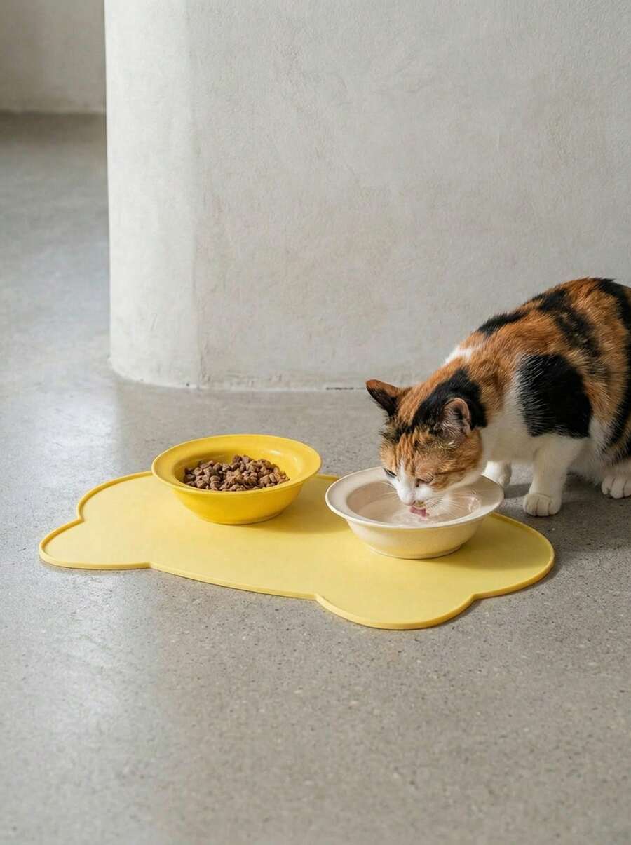 Multicolor silicone pet food mat with cartoon pattern, waterproof non-slip surface, and raised edges for dog and cat bowls.