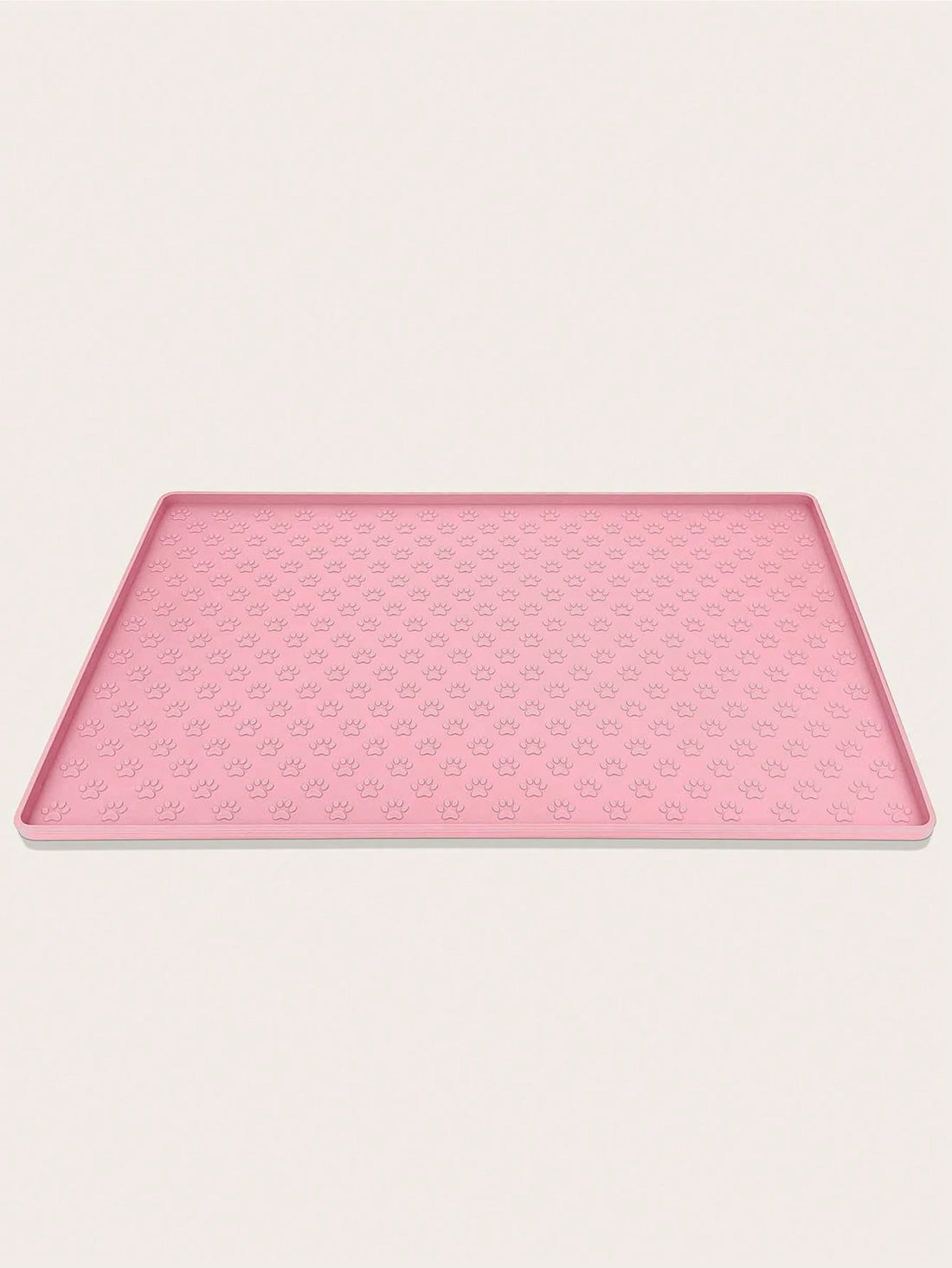 Pink silicone pet placemat featuring a colorblock pattern and paw prints for cats and dogs