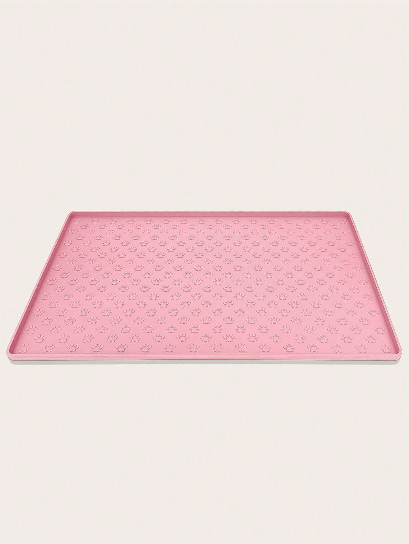 Pink silicone pet placemat featuring a colorblock pattern and paw prints for cats and dogs