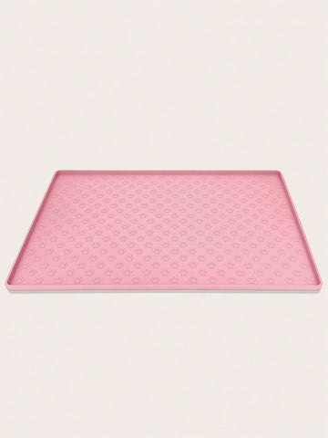 Pink silicone pet placemat featuring a colorblock pattern and paw prints for cats and dogs
