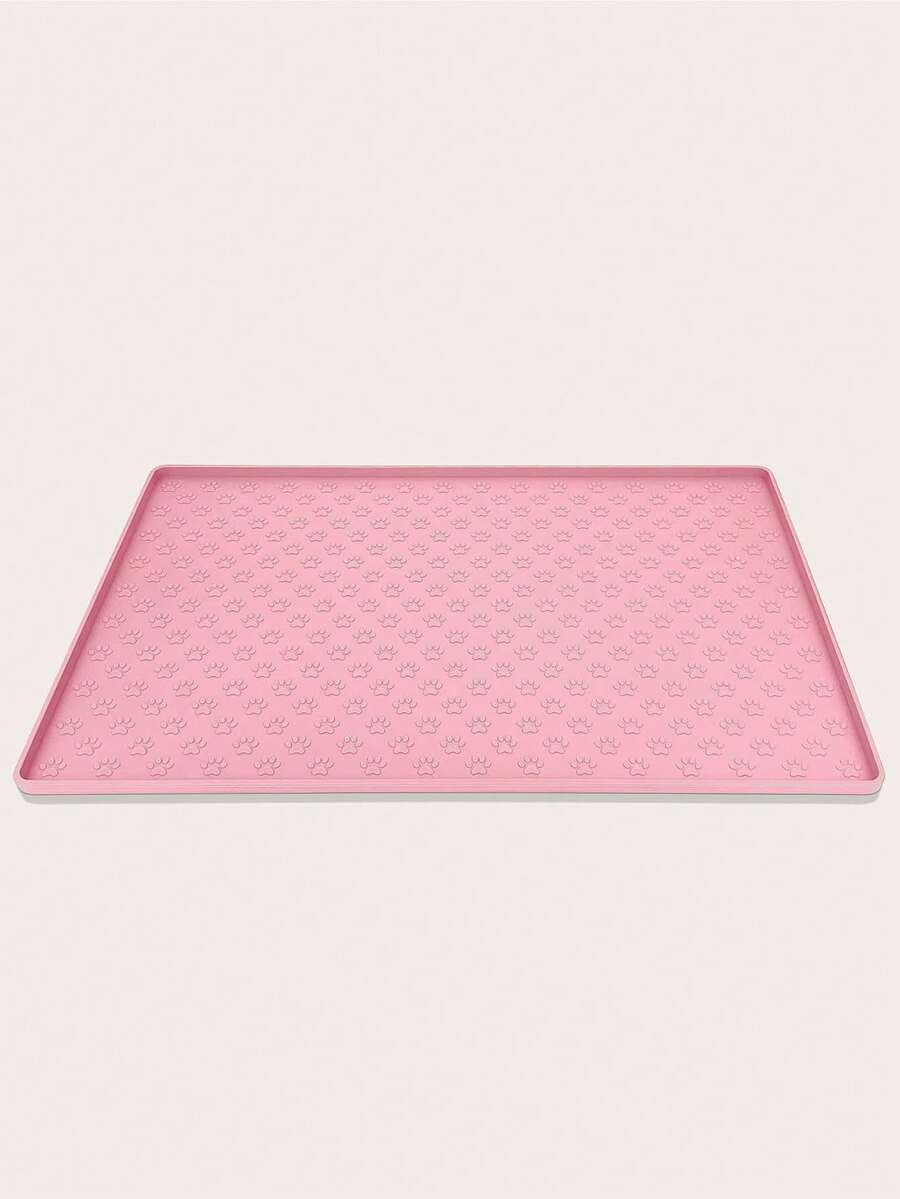 Pink silicone pet placemat featuring a colorblock pattern and paw prints for cats and dogs