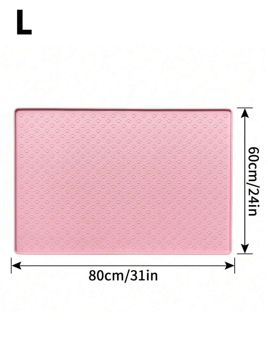 Pink silicone pet placemat featuring a colorblock pattern and paw prints for cats and dogs