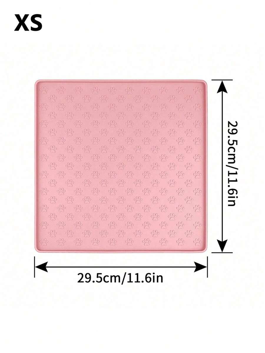 Pink silicone pet placemat featuring a colorblock pattern and paw prints for cats and dogs