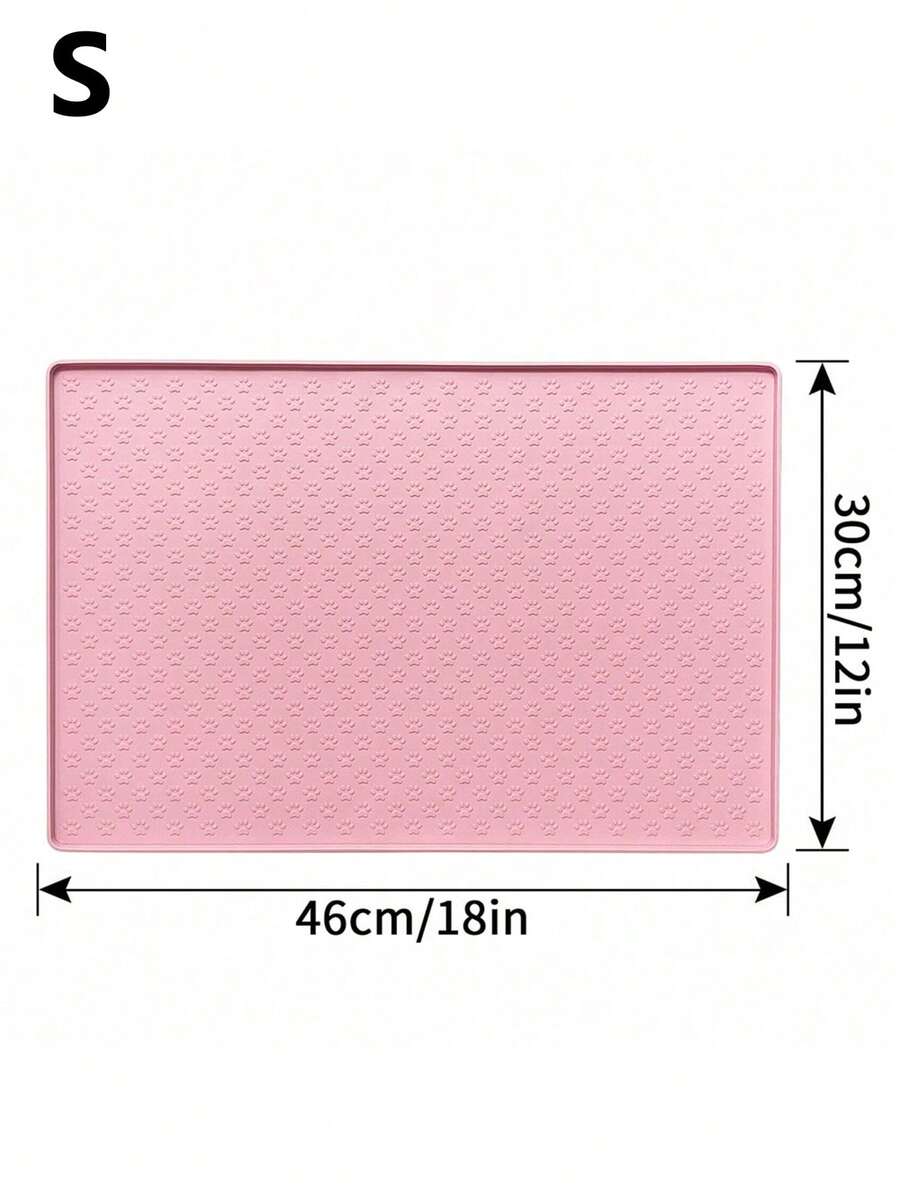 Pink silicone pet placemat featuring a colorblock pattern and paw prints for cats and dogs