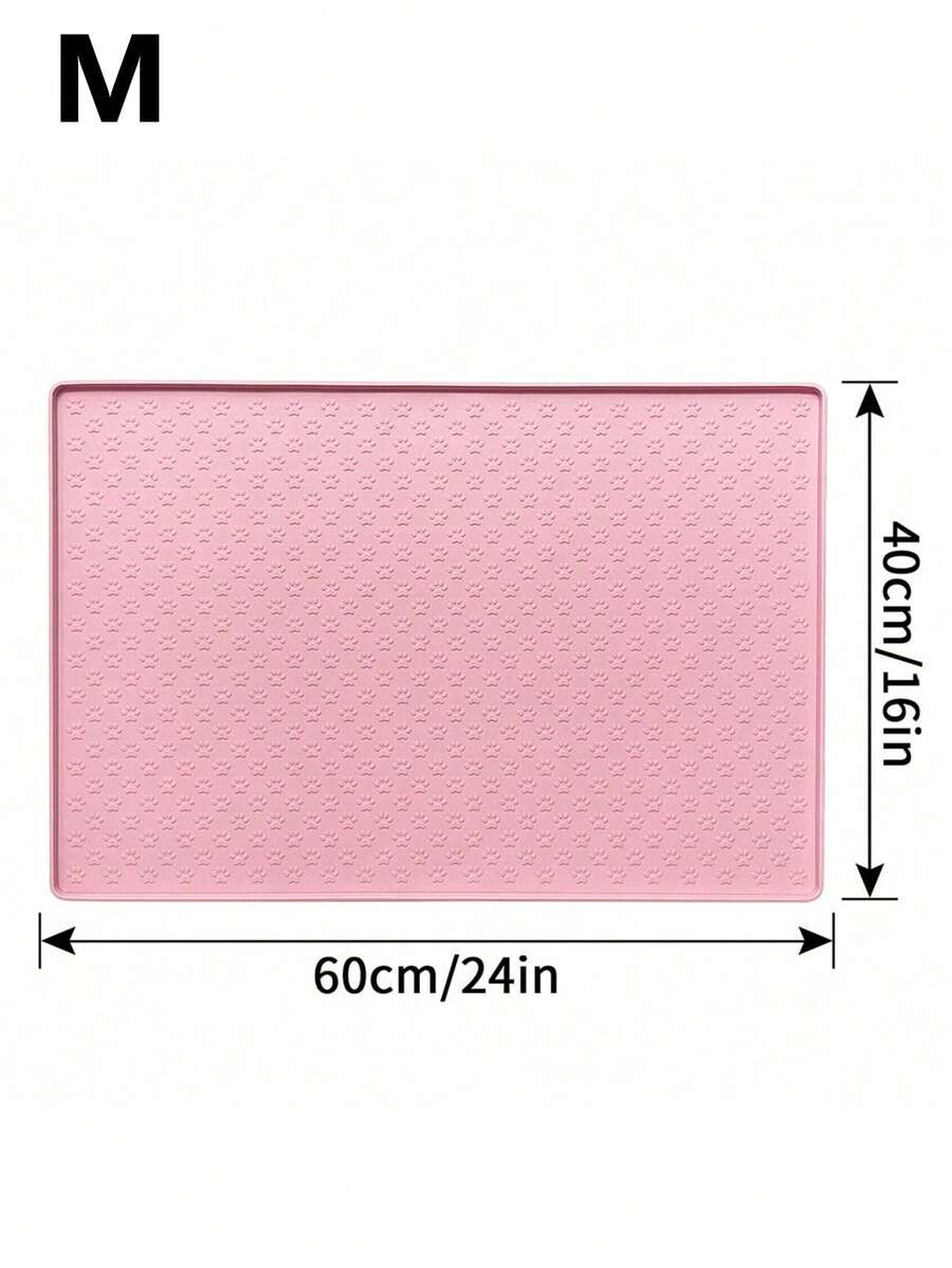 Pink silicone pet placemat featuring a colorblock pattern and paw prints for cats and dogs