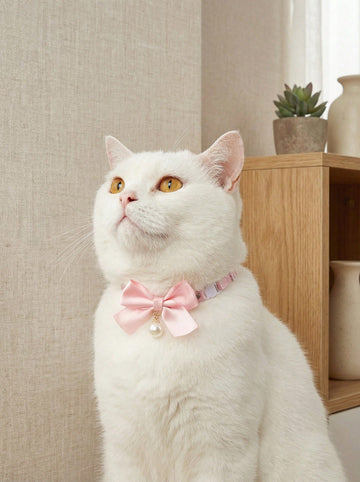 Pink floral breakaway cat collar with bow, pearls, and lace-style details for an adjustable kitten or girl cat collar.