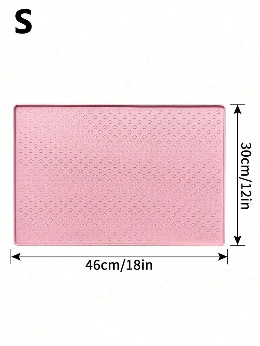 Pink silicone pet placemat featuring a colorblock pattern and paw prints for cats and dogs