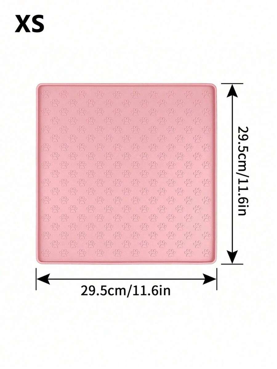 Pink silicone pet placemat featuring a colorblock pattern and paw prints for cats and dogs