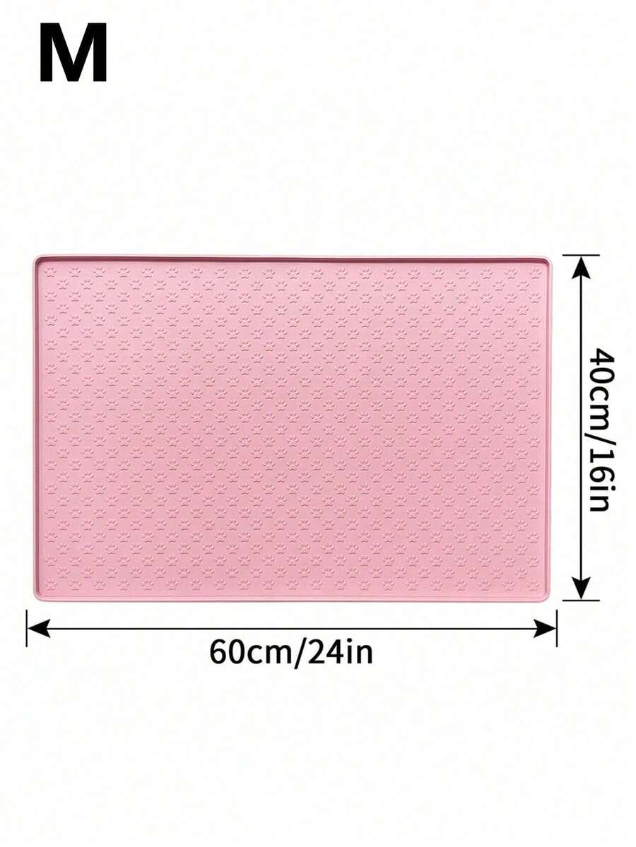 Pink silicone pet placemat featuring a colorblock pattern and paw prints for cats and dogs