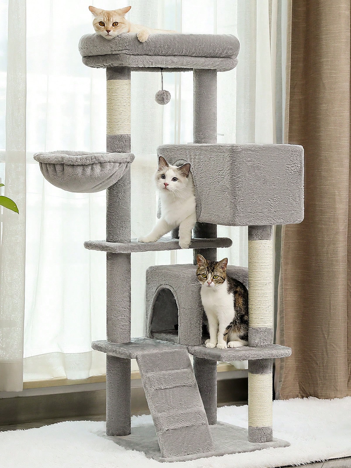 56.3 inch grey multi-level cat tree with large top perch, two condos, plush hammock, and sisal scratching posts.