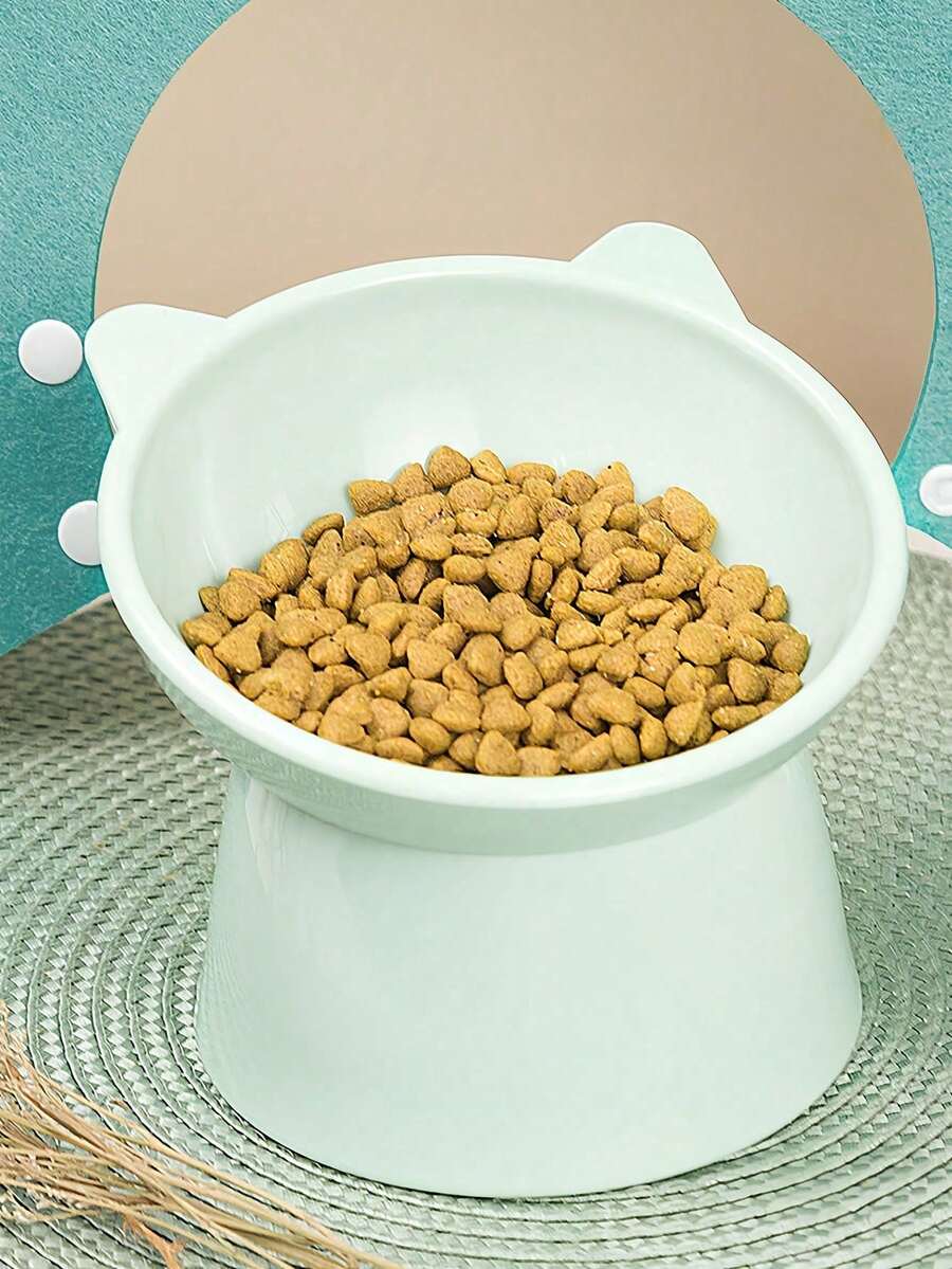 Multicolor ABS 15 degree slanted anti-vomiting pet bowl with stable base and cartoon pattern for indoor cats and dogs.