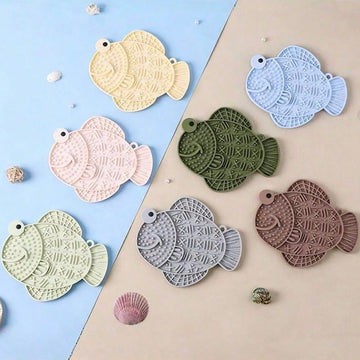 Multicolor silicone slow feeder lick mat with suction cups for dogs and cats featuring fish and frog shape design.