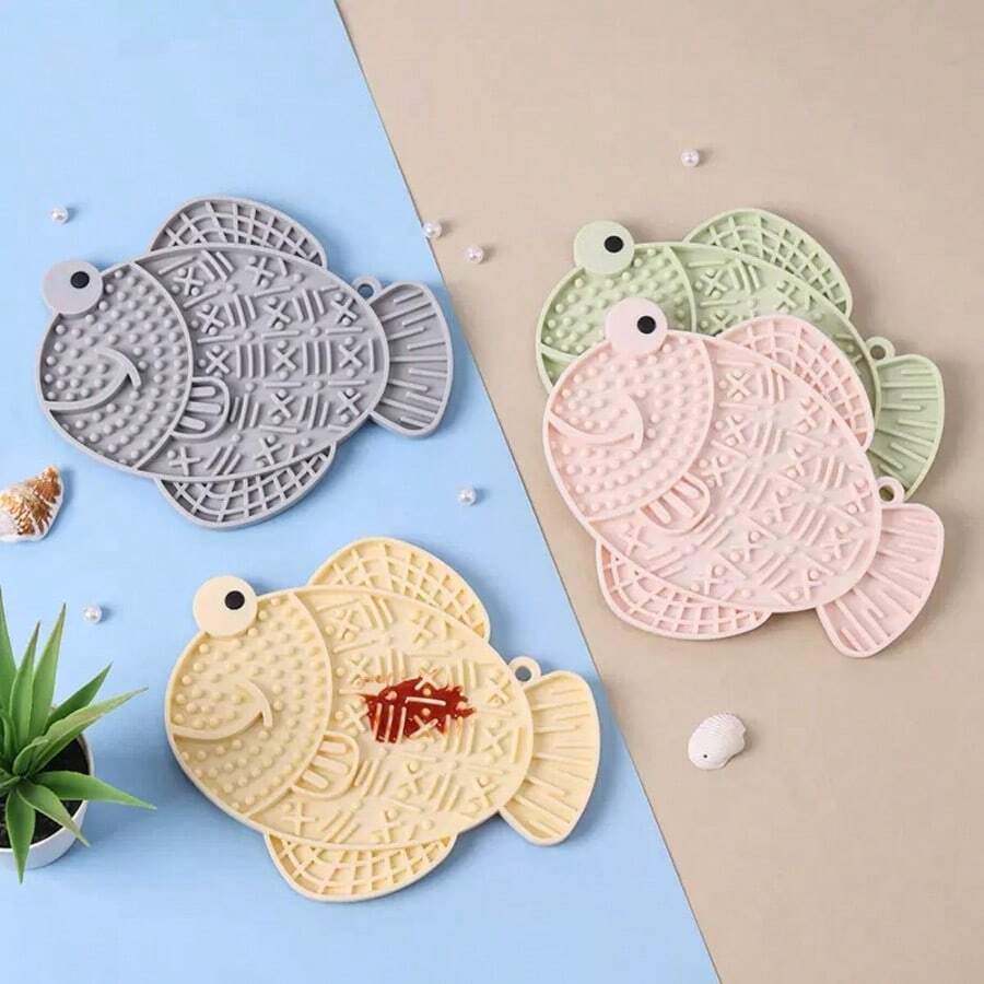 Multicolor silicone slow feeder lick mat with suction cups for dogs and cats featuring fish and frog shape design.