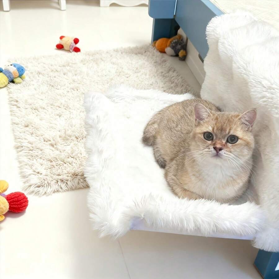 Plush cat bedside hammock bed hung on a bed edge, featuring soft warm polyester cushion for small cats and dogs.