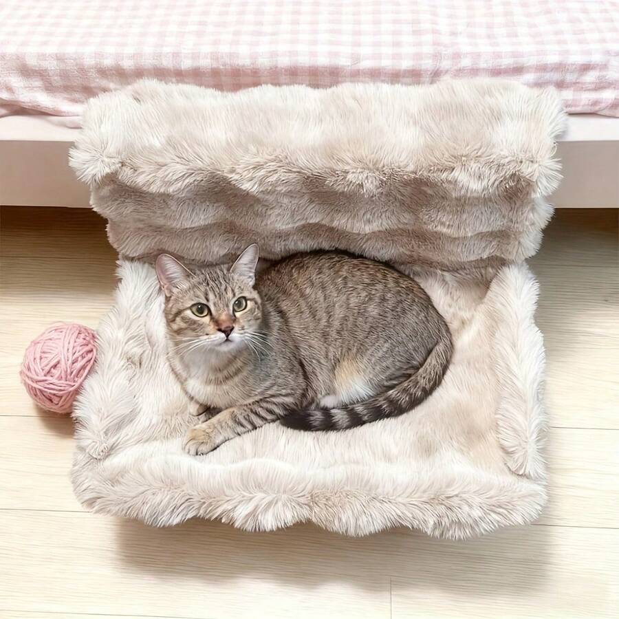 Plush cat bedside hammock bed hung on a bed edge, featuring soft warm polyester cushion for small cats and dogs.