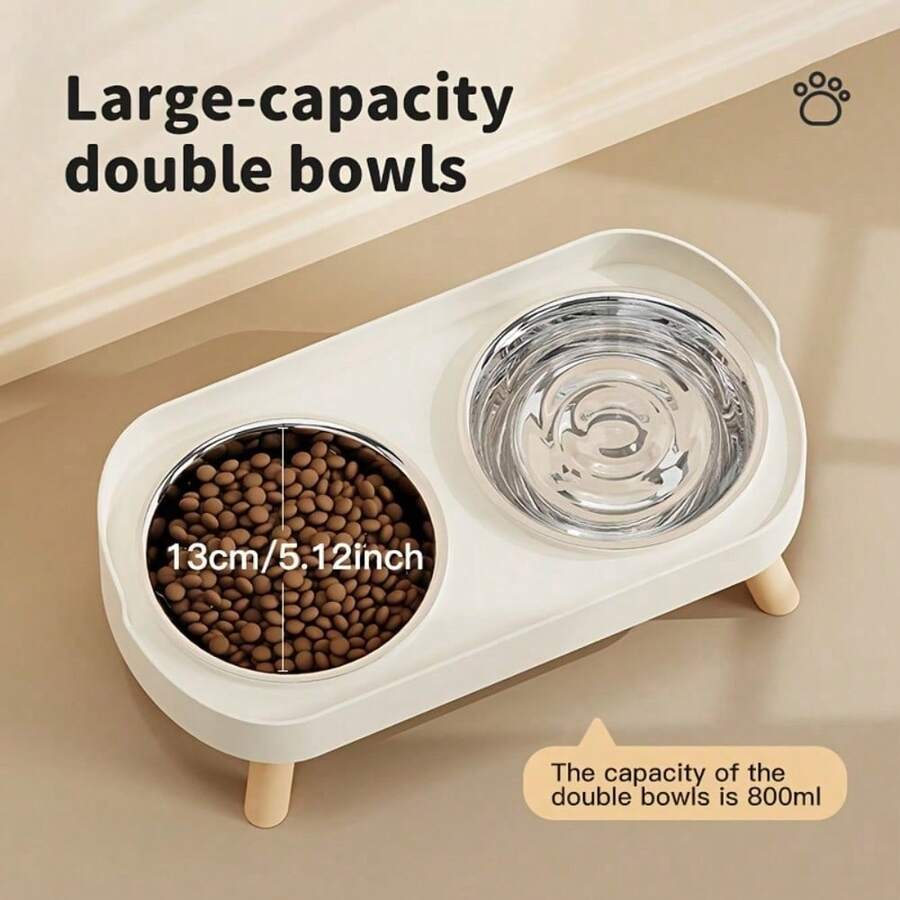 An elevated double bowl feeder for dogs made of durable ABS material in a colorblock design with an 800ml capacity for food and water.