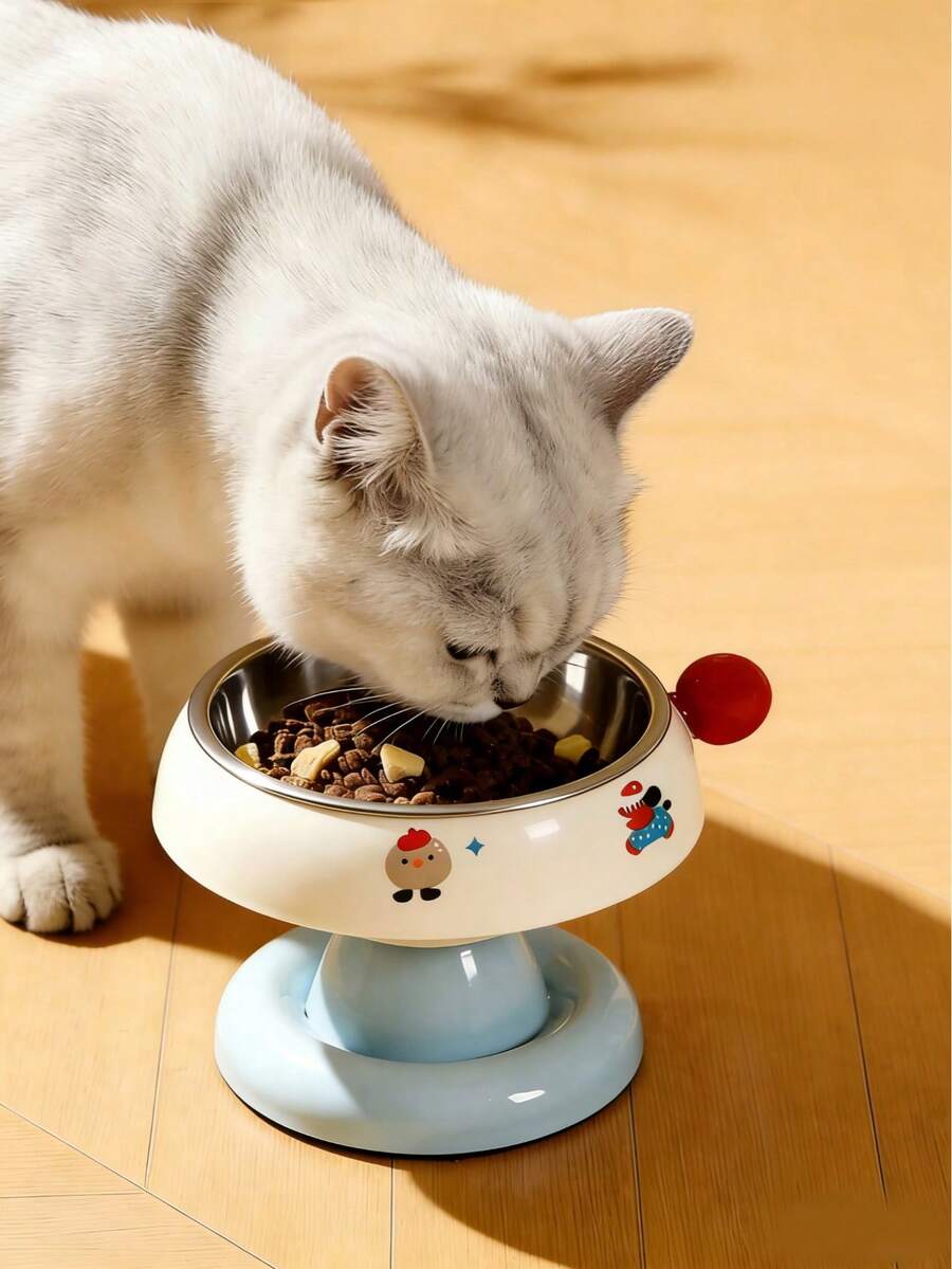 Elevated pet food bowl with cute cartoon style design, stainless steel lining, PP stand, and anti-slip base for cats and dogs.