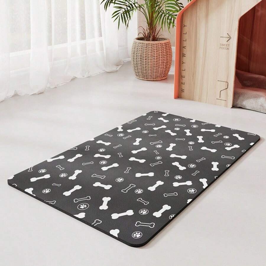 Diatomite pet feeding mat featuring a cute black paw print pattern and wood grain design under cat and dog food bowls.