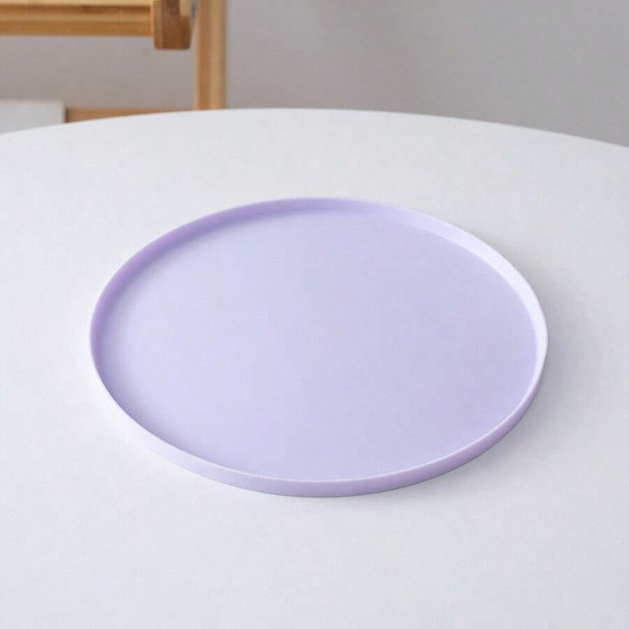 Round multicolor silicone pet food mat with raised edges for cats and dogs.