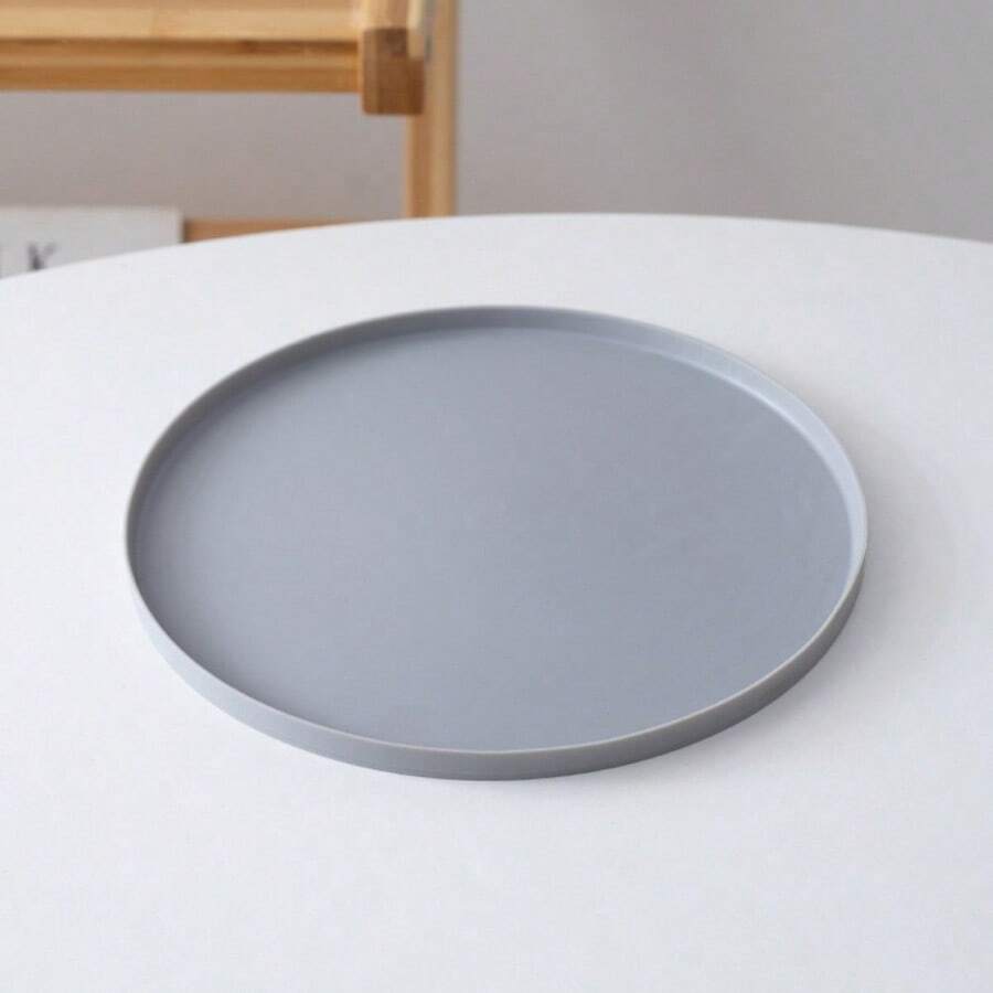 Round multicolor silicone pet food mat with raised edges for cats and dogs.