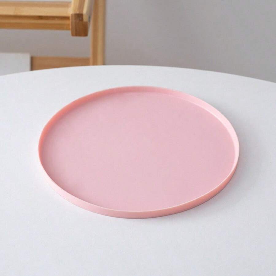 Round multicolor silicone pet food mat with raised edges for cats and dogs.