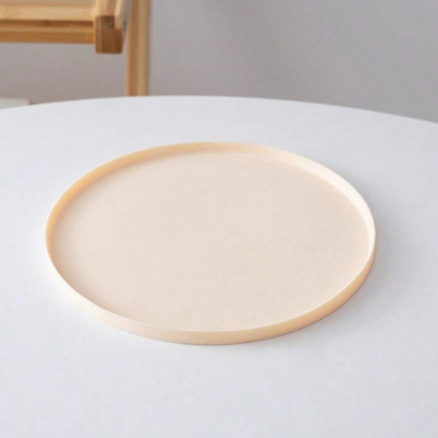 Round multicolor silicone pet food mat with raised edges for cats and dogs.