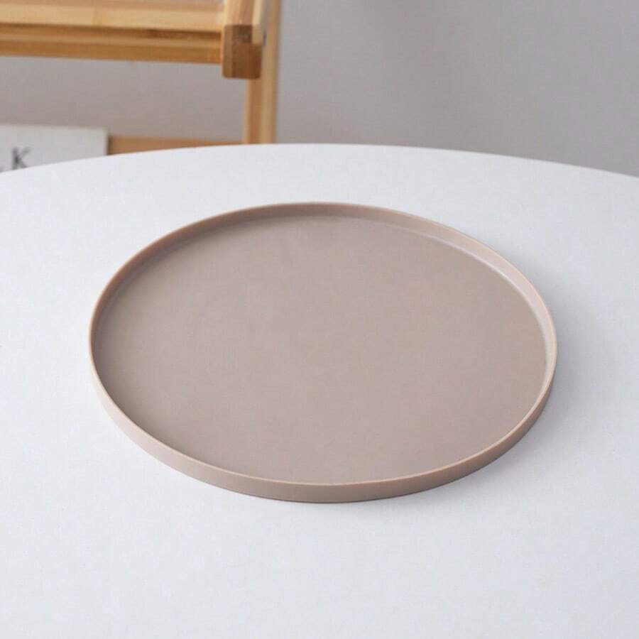 Round multicolor silicone pet food mat with raised edges for cats and dogs.
