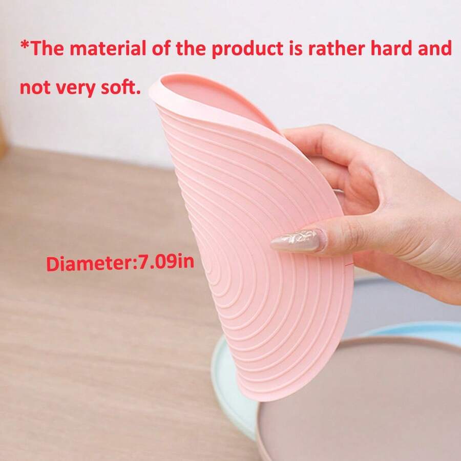 Round multicolor silicone pet food mat with raised edges for cats and dogs.