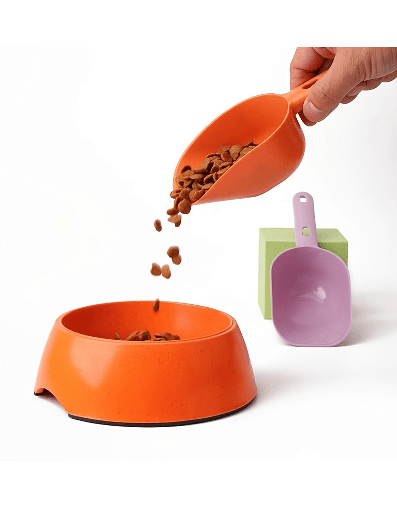 Multicolor plastic pet food scoop with an ergonomic handle for measuring dog and cat food