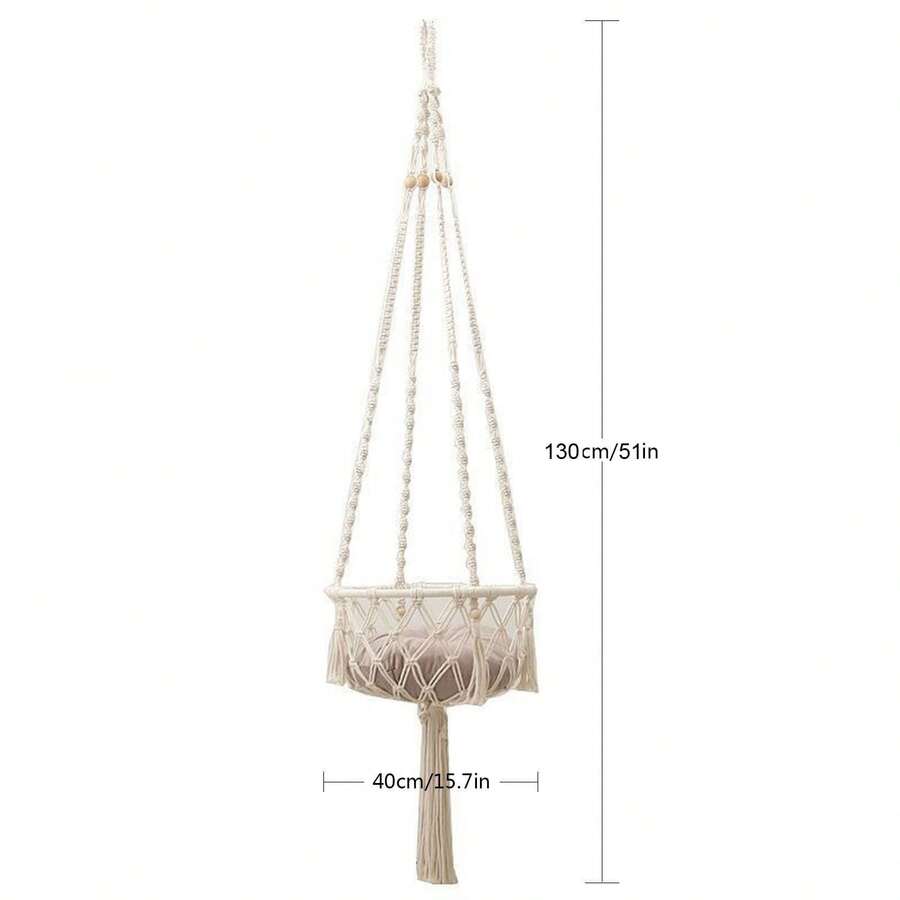 Beige handwoven macrame cat hammock featuring a geometric fiber art pattern hanging as a wall mounted swing bed for cats.