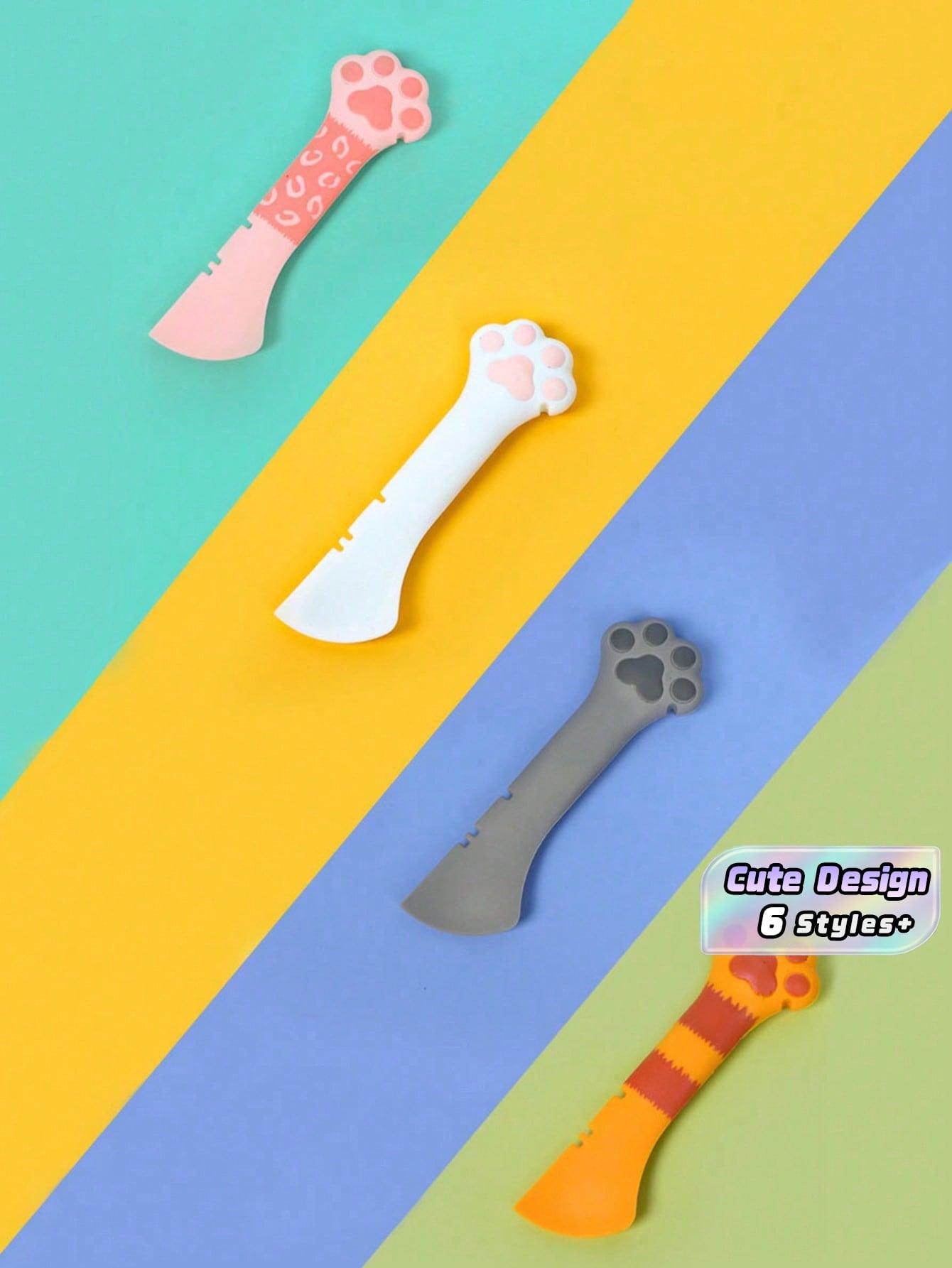 Multicolor cat paw shaped silicone pet can spoon and opener tool for feeding cats, dogs, and small animals.