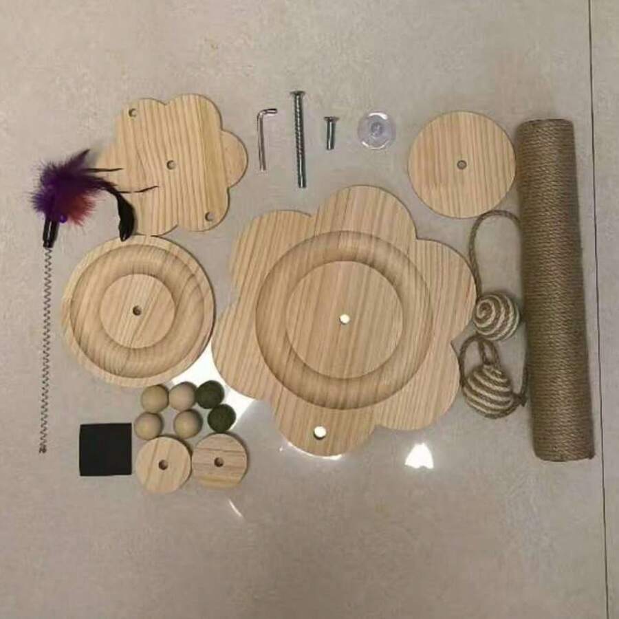 Multicolor wooden cat scratch pole activity center featuring a scratching post, two horizontal ball tracks, an interactive feather toy, and hanging sisal balls.