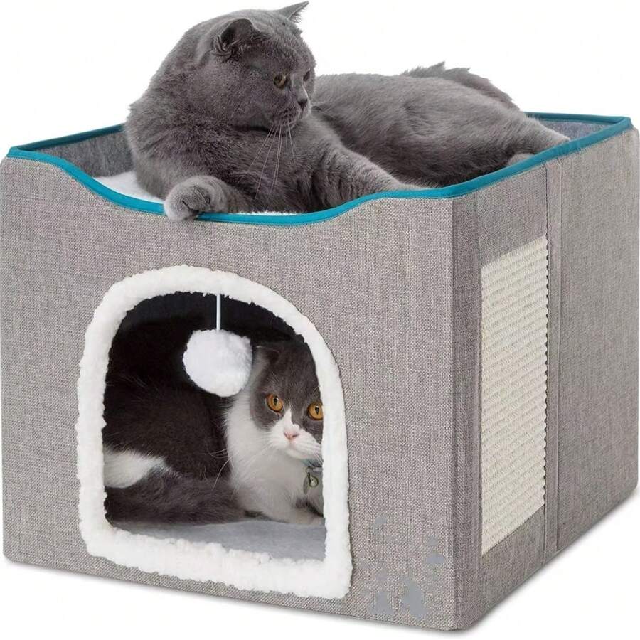 Grey foldable fabric cat cave bed featuring a scratch pad and hanging fluffy ball for indoor cats