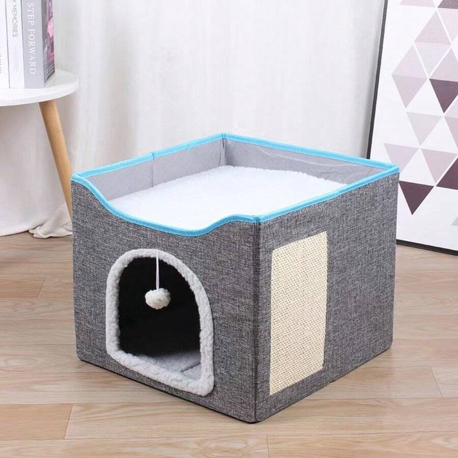 Grey foldable fabric cat cave bed featuring a scratch pad and hanging fluffy ball for indoor cats