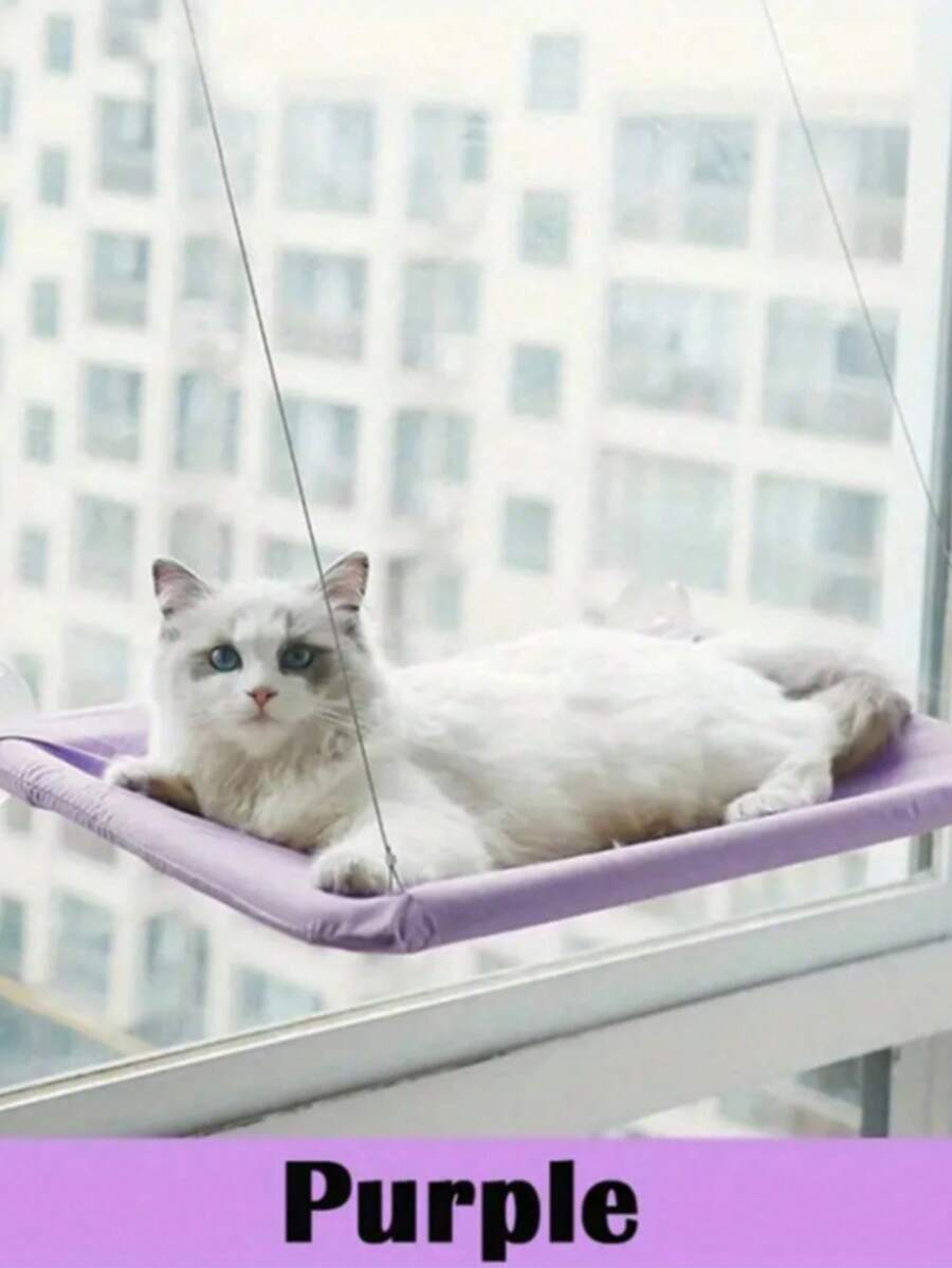 Suspended cat window hammock bed with sturdy ABS frame, mounting brackets, and cozy blanket installed on a glass window.