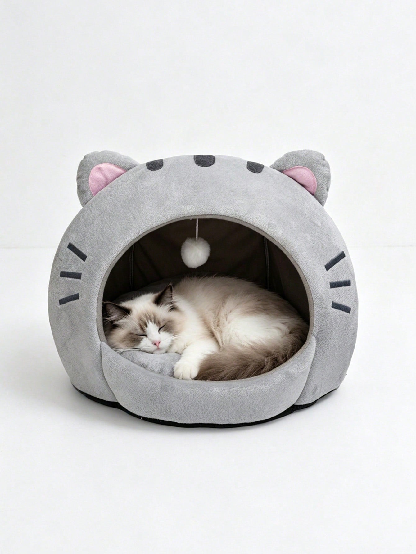 Multicolor soft cat bed featuring a cartoon pattern design suitable as a comfortable sleeping basket for cats and dogs.