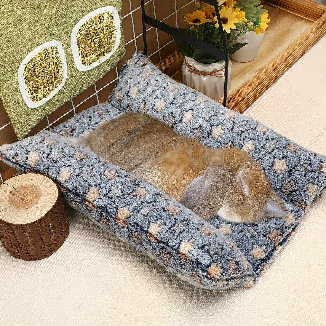 Navy blue soft plush wrap-around pet bed with raised edges for rabbits and small animals.