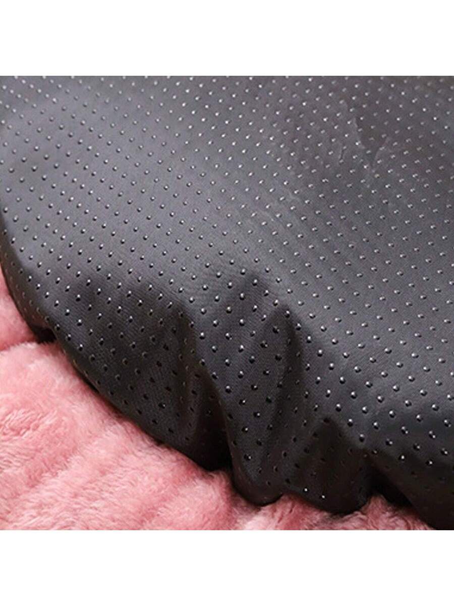 Pink round plush pet bed made of soft short plush material for small and medium cats and dogs.